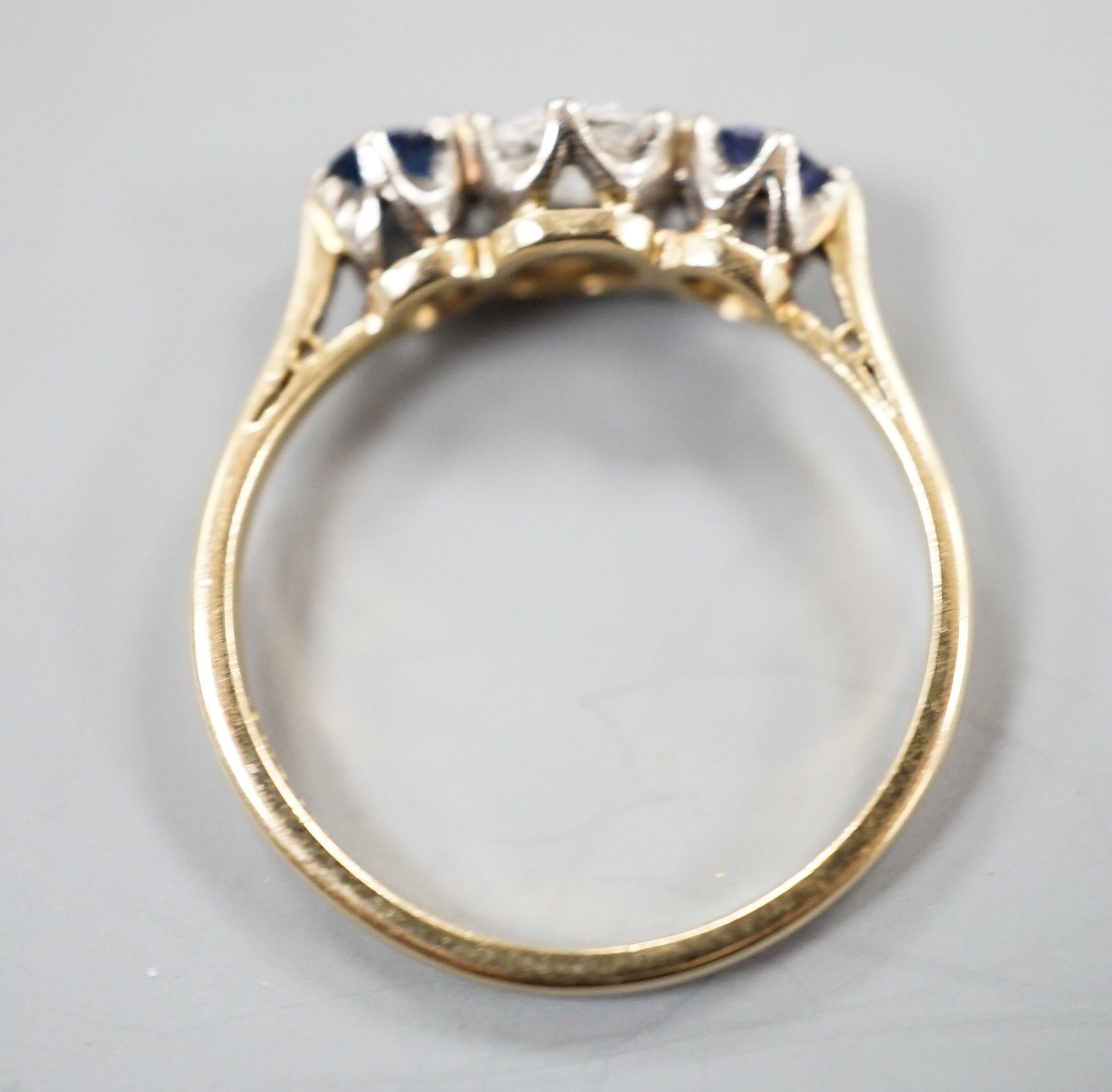 An 18ct & Plat, two stone sapphire and single stone diamond ring, size R, gross weight 3.1 grams.